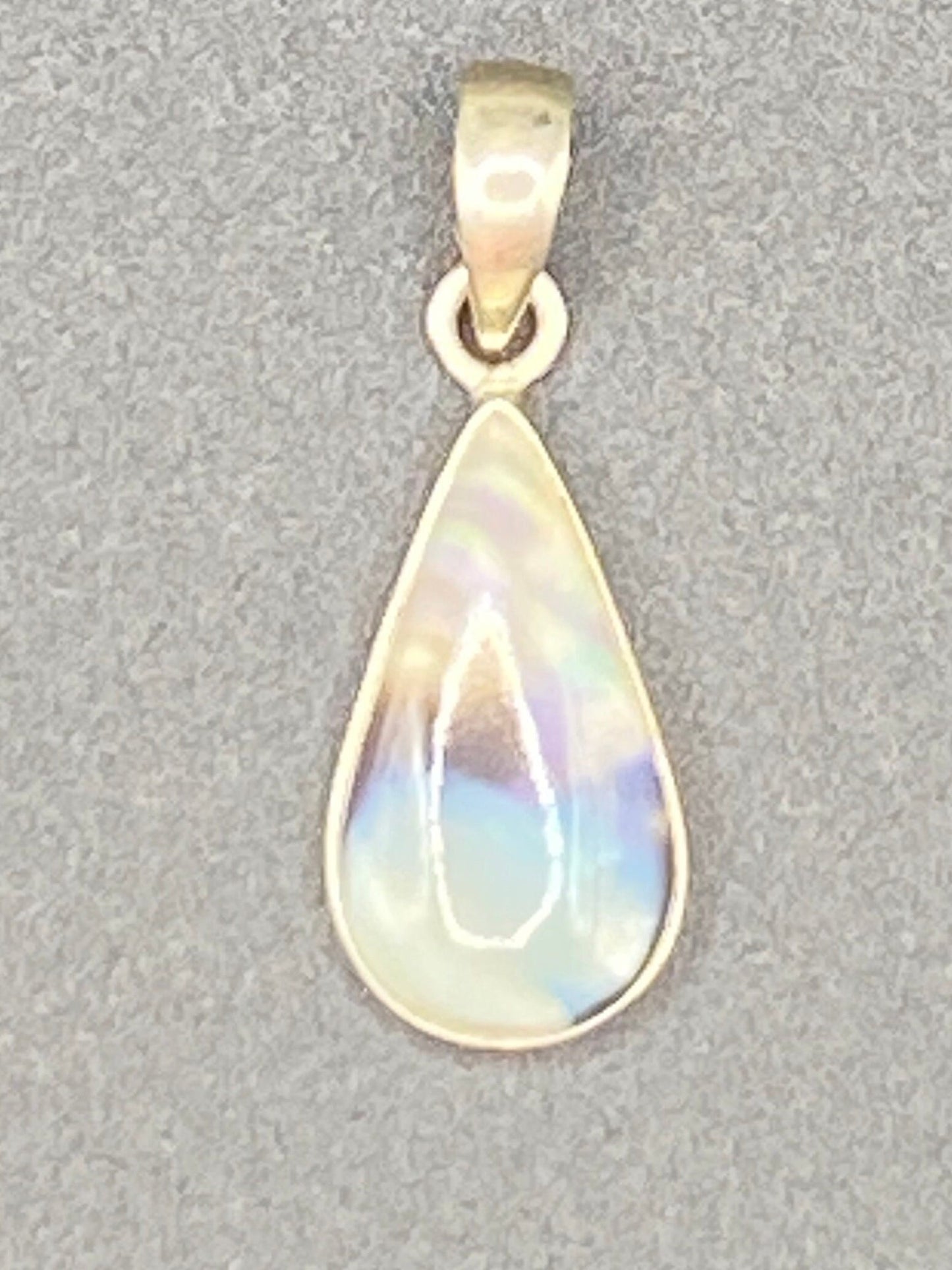 Gorgeous small Rainbow Agate with Opal flash Pendant