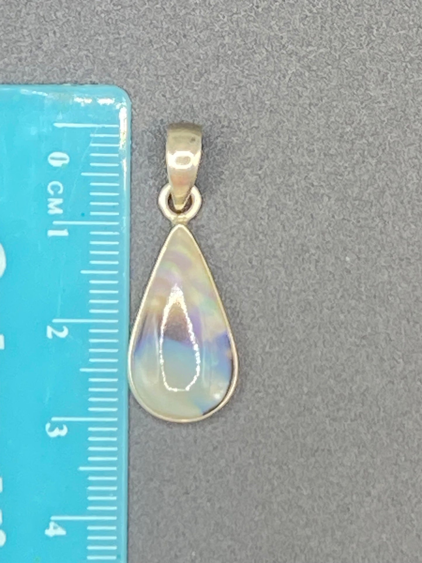 Gorgeous small Rainbow Agate with Opal flash Pendant